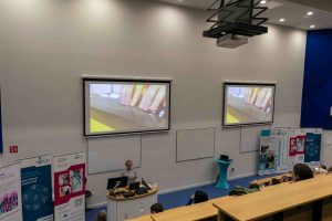 sile presenting with video of braille device on 2 screens